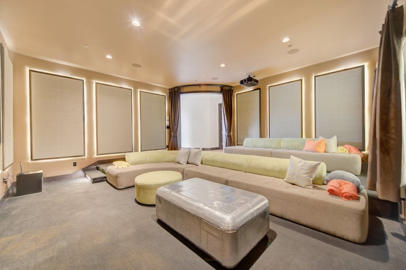 Media lounge with surround sound and cozy textures for a full cinema vibe.