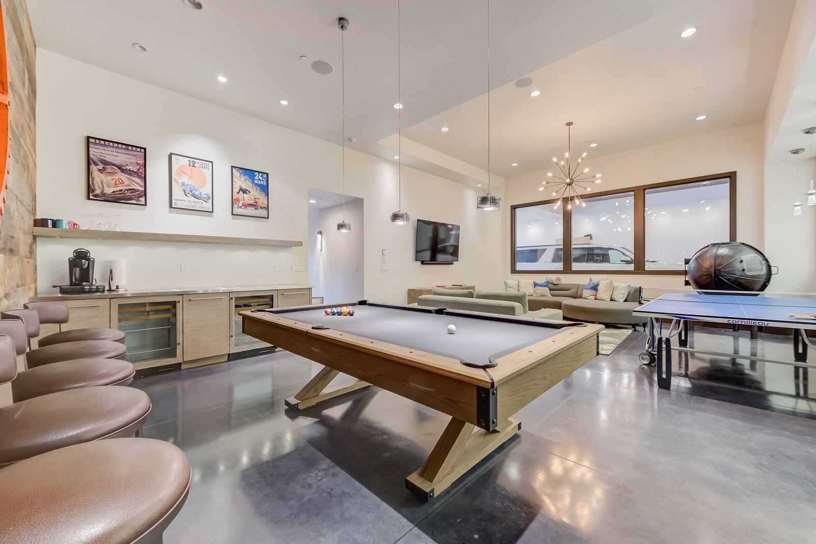 Pool table and banquette seating combine fun and function in this recreation zone.
