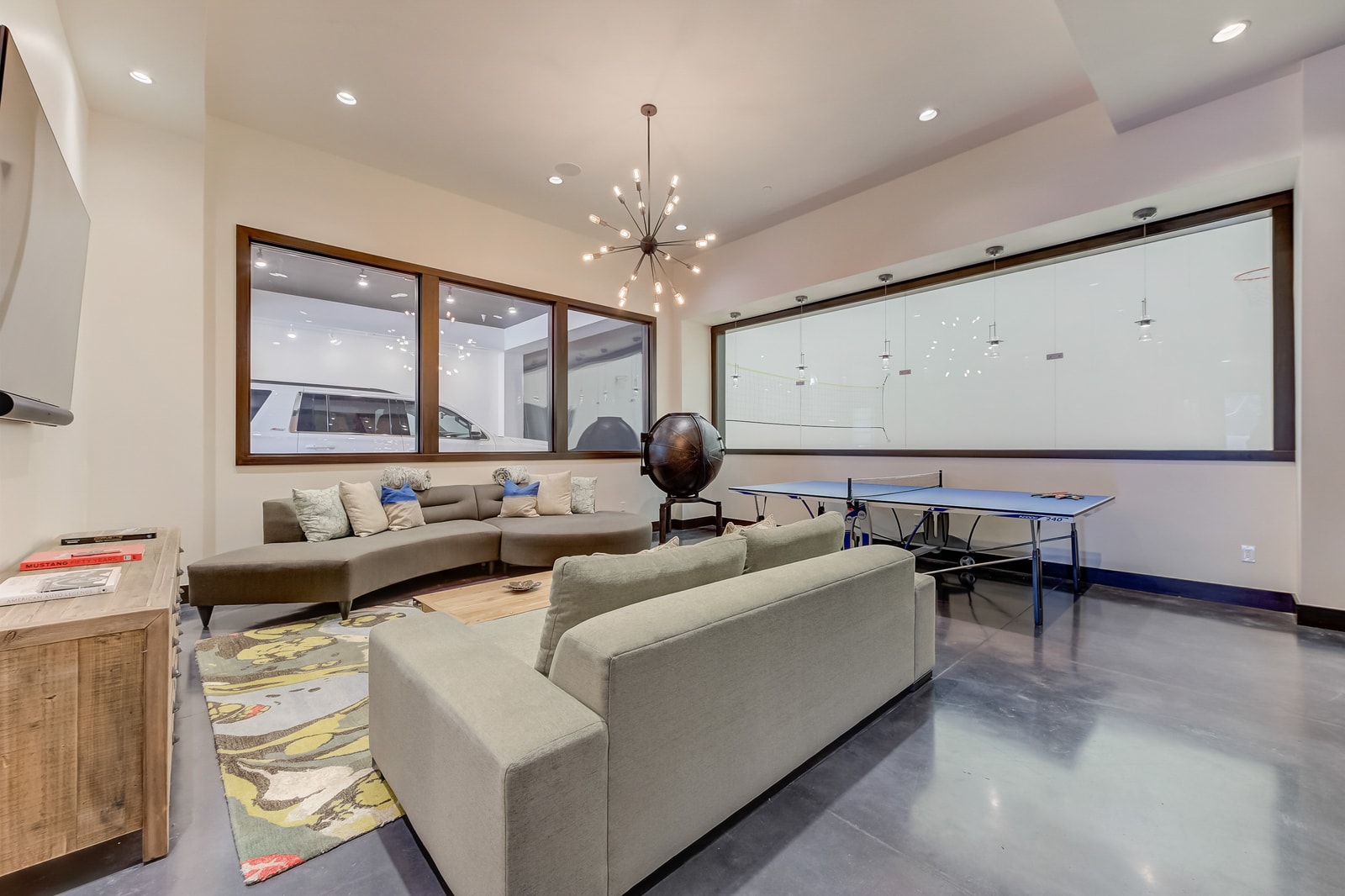 Lounge, read, or connect in this bright family room with wood accents and style.