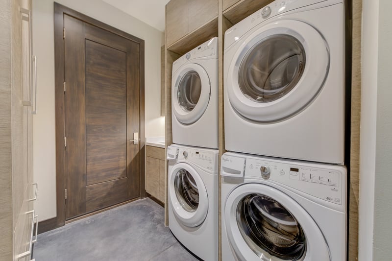 Full laundry room with dual washers and dryers to handle group stays.
