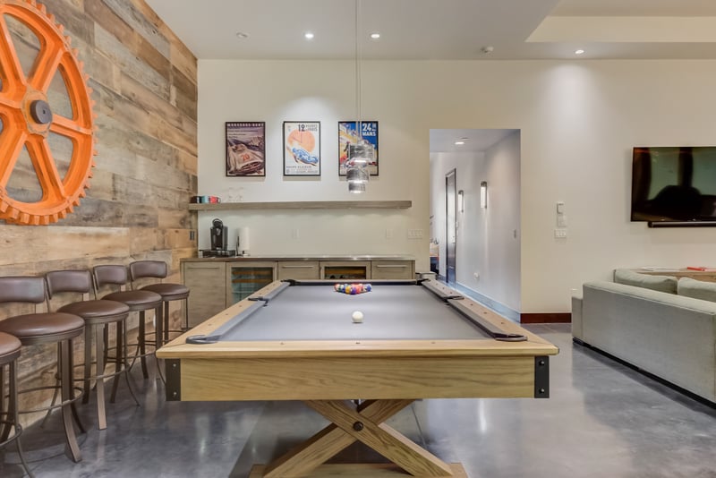 This open lounge has a pool table, wet bar, and fun for all ages.