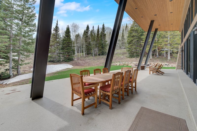Dine al fresco on your covered patio with peaceful views of the trees.