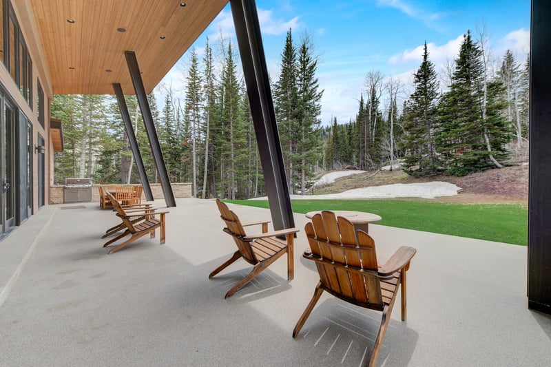 Adirondack chairs line the patio for morning coffee or post-hike drinks.