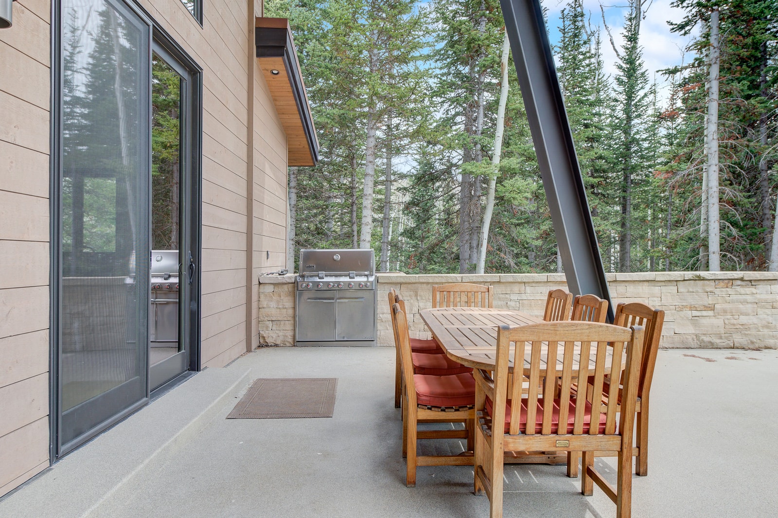 Covered patio just off the living area is perfect for grilling or lounging outdoors.