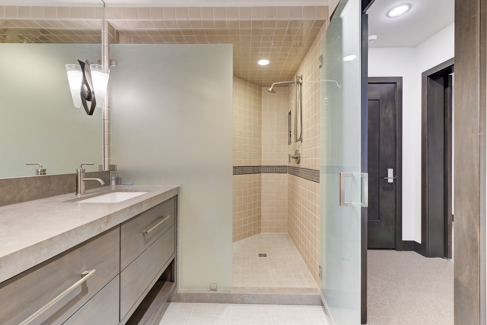 Step-in shower and full vanity in this spacious ensuite.