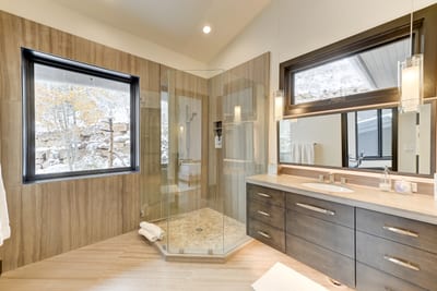Attached bath includes statement vanity, full shower, and storage.