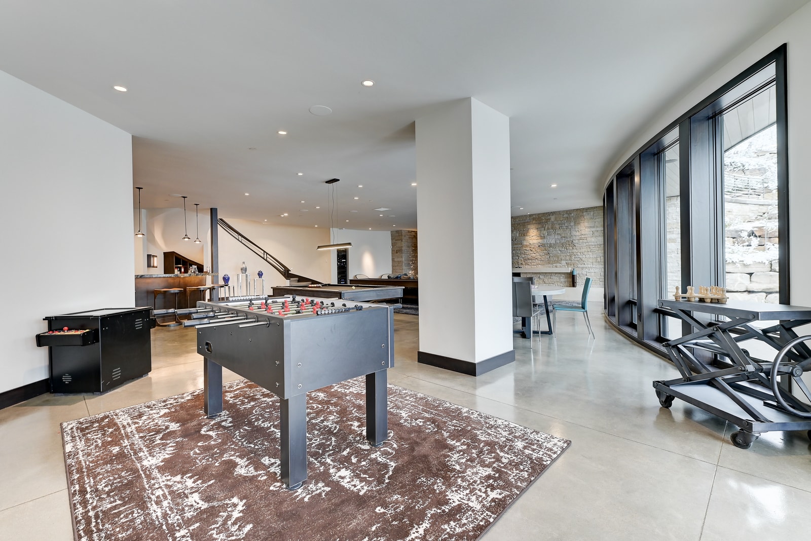 Flexible common area connects to additional rec and guest spaces.