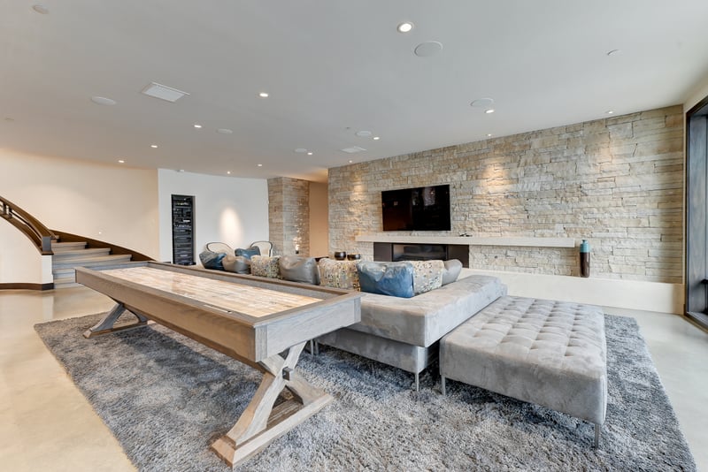 Shuffle table, sectional, and mounted TV make this the ultimate hangout.