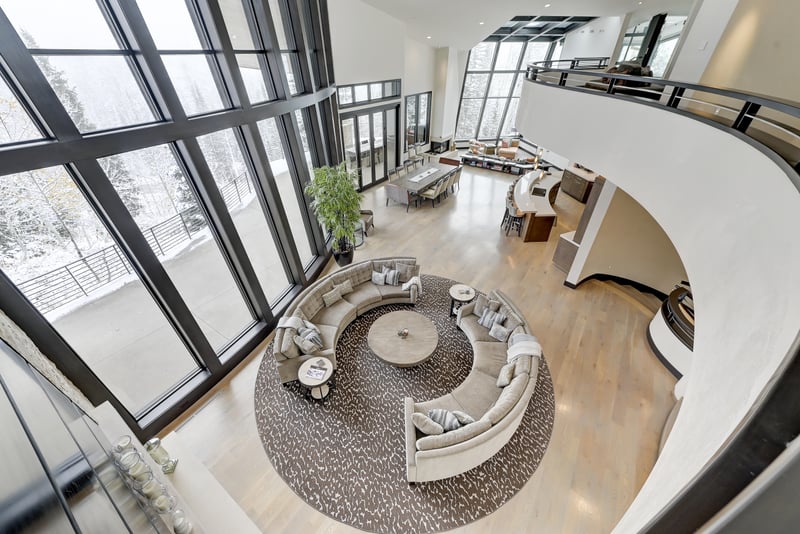 Dramatic overlook reveals the home’s signature curves and custom architecture.