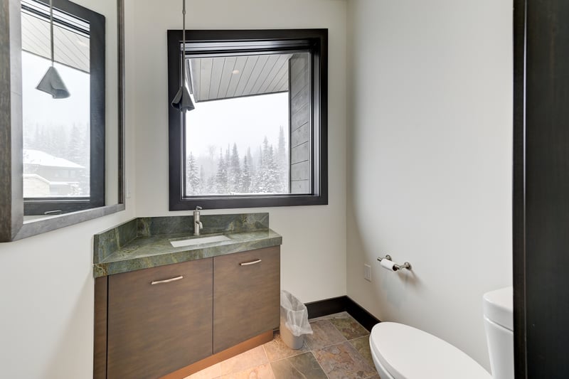 On the top level with the bunk beds, there is a full bathroom with step in shower PCO-184M