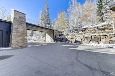 Exterior entry layout shows driveway, garage, and easy main-level access. PCO-184M