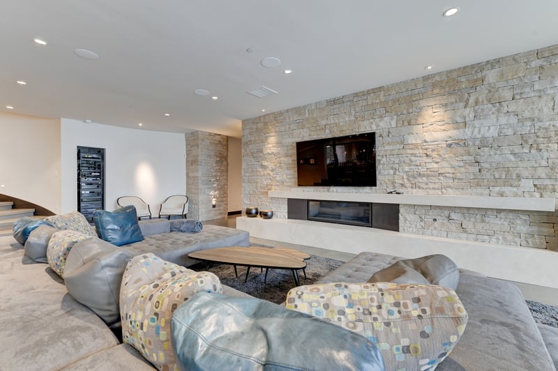 Cozy lounge area with fireplace and large-screen TV for group relaxation.