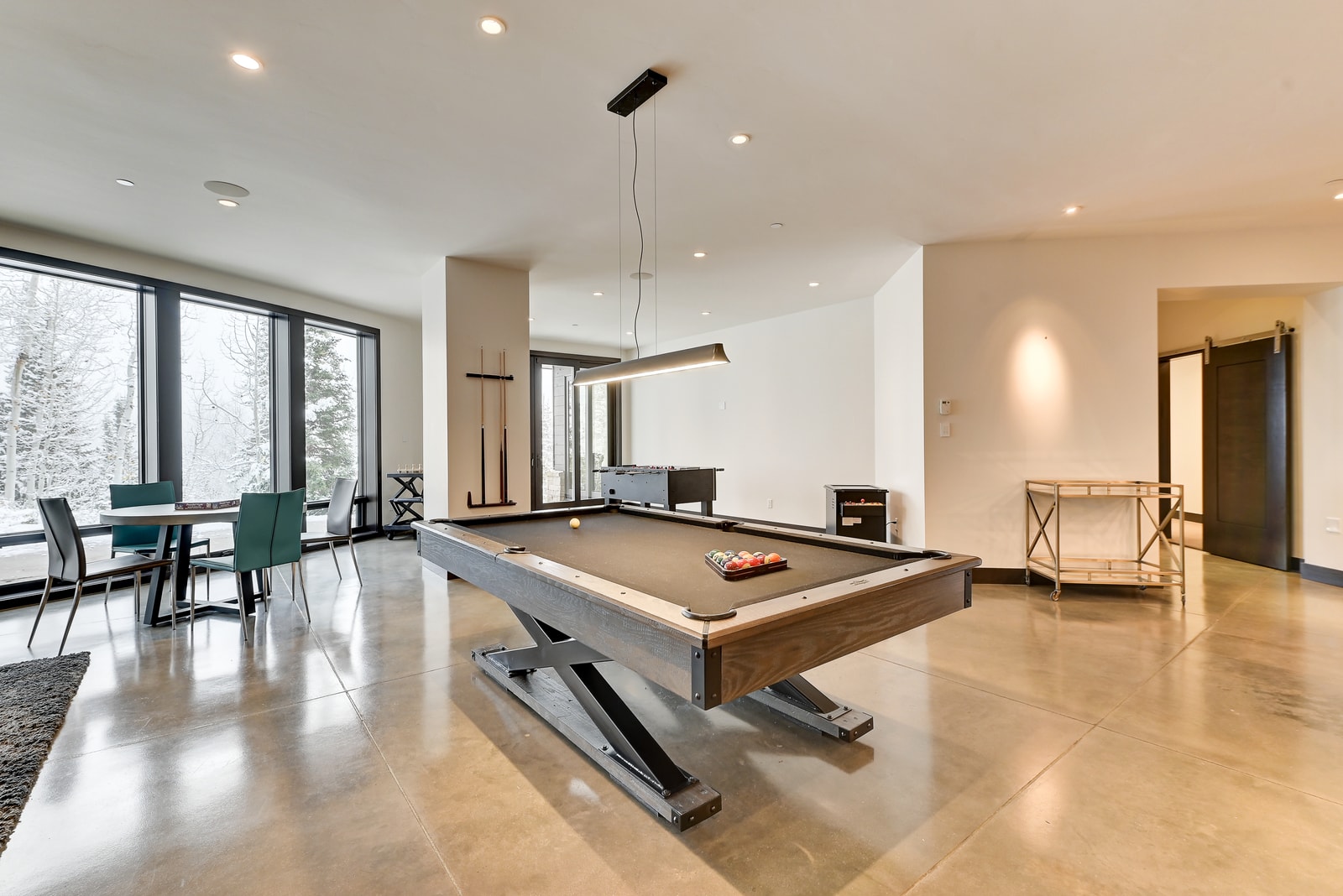 Billiards table anchors this open-concept lounge with plenty of seating.