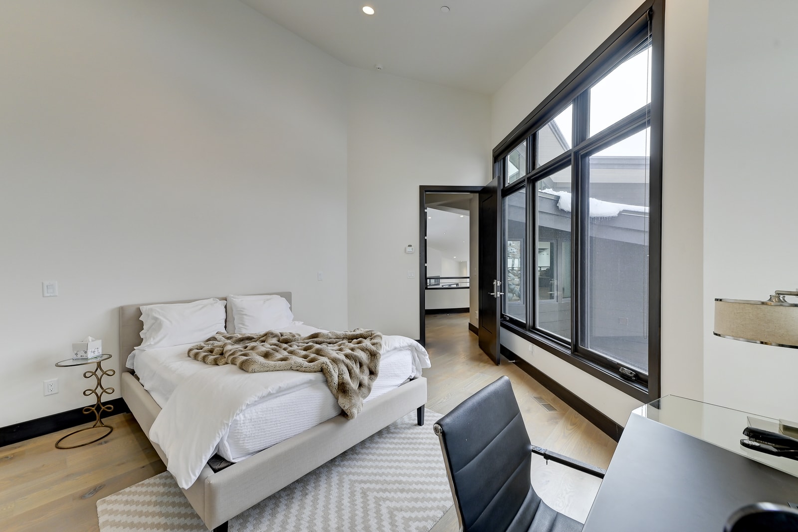 Spacious layout and warm wood tones give this room a polished, calming vibe.