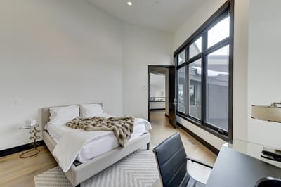 Spacious layout and warm wood tones give this room a polished, calming vibe.