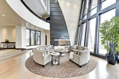 Grand circular seating under soaring ceilings offers a striking yet cozy gathering space. PCO-184M