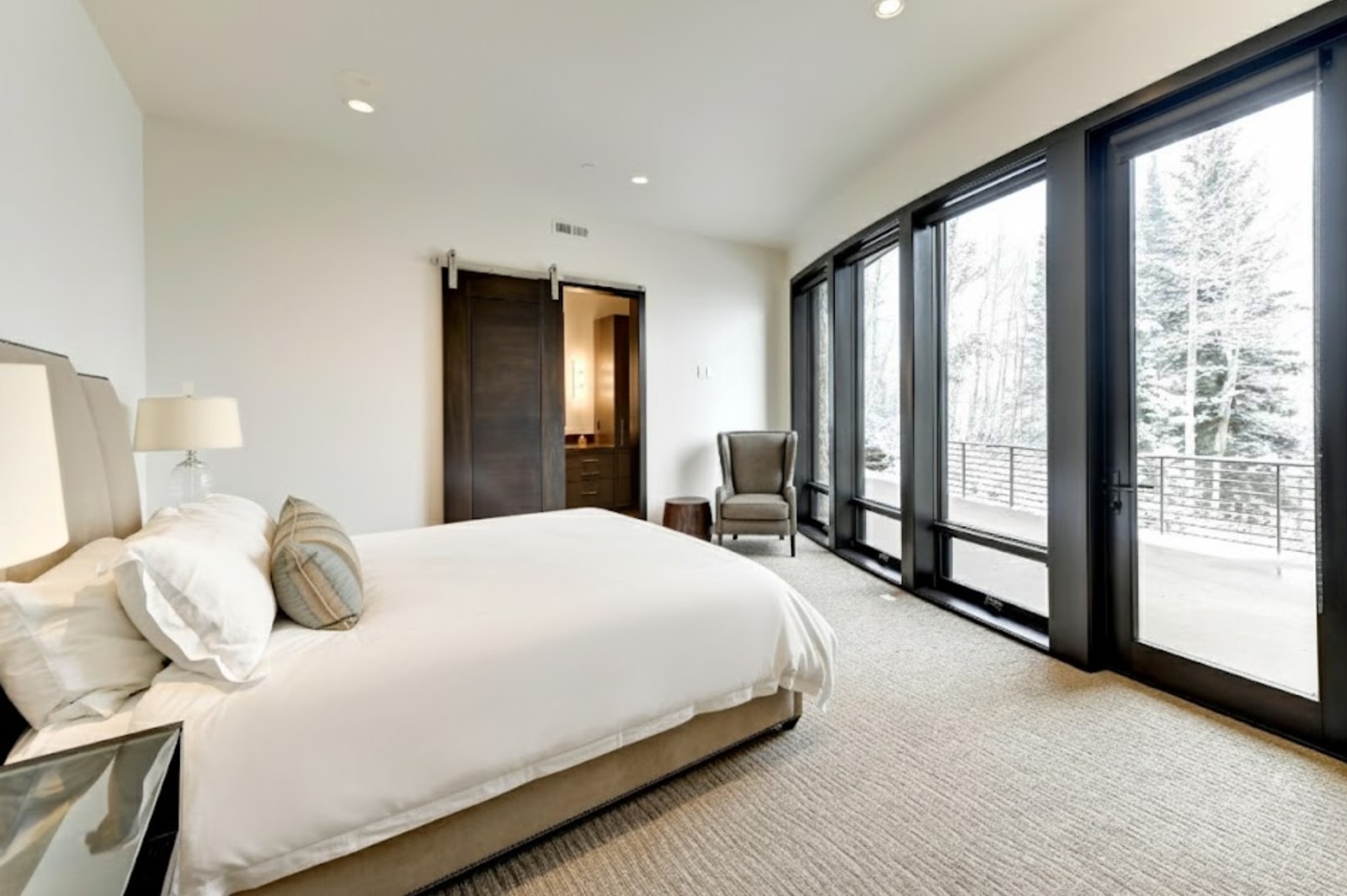 Retreat to your main-level King suite with lounge seating and private patio access.