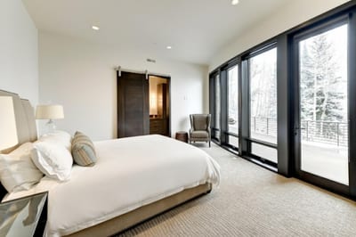 Retreat to your main-level King suite with lounge seating and private patio access. PCO-184M