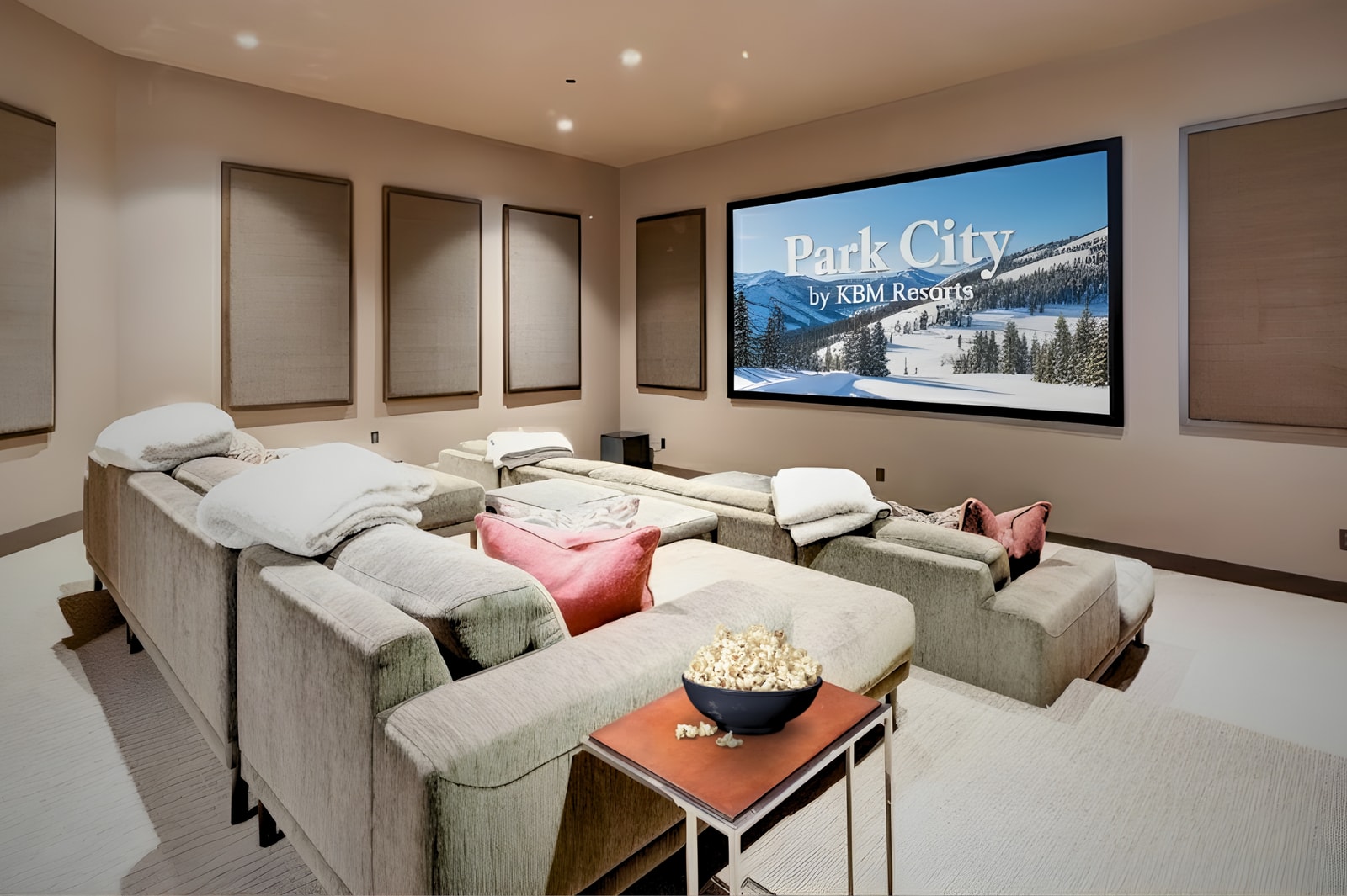 Dedicated theater with tiered seating and oversized screen for movie nights at home.