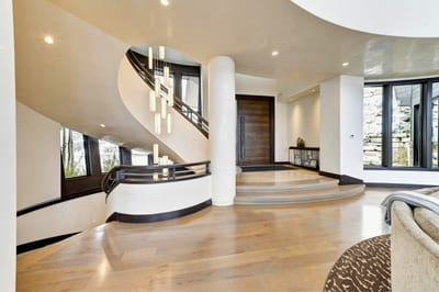 Elegant curved staircase welcomes you into the light-filled main level. PCO-184M