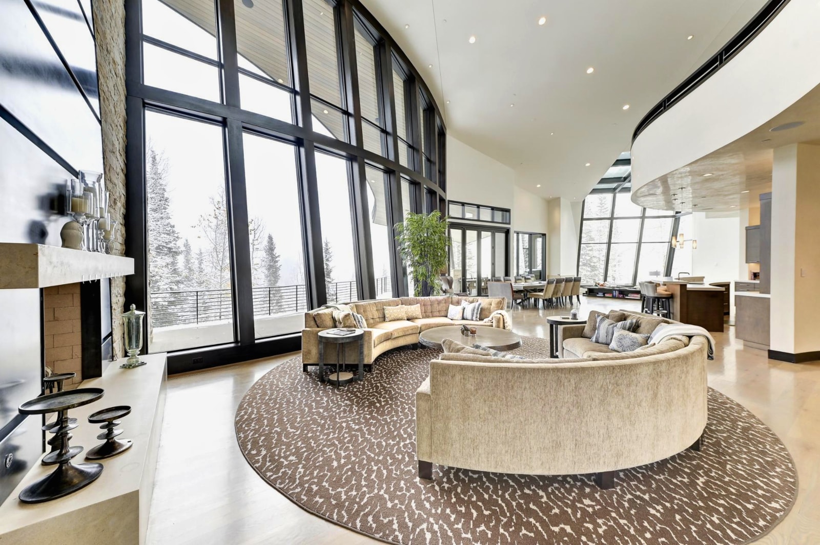 Vaulted ceilings, fireplace, and mountain views create a stunning space to connect.