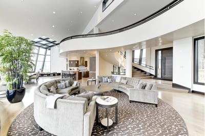 Artful curves and designer furnishings elevate the spacious central lounge. PCO-184M