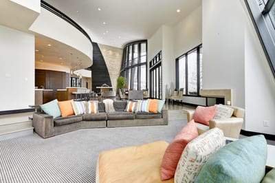 Colorful cushions and oversized sofas provide a laid-back feel in the secondary living area. PCO-184M