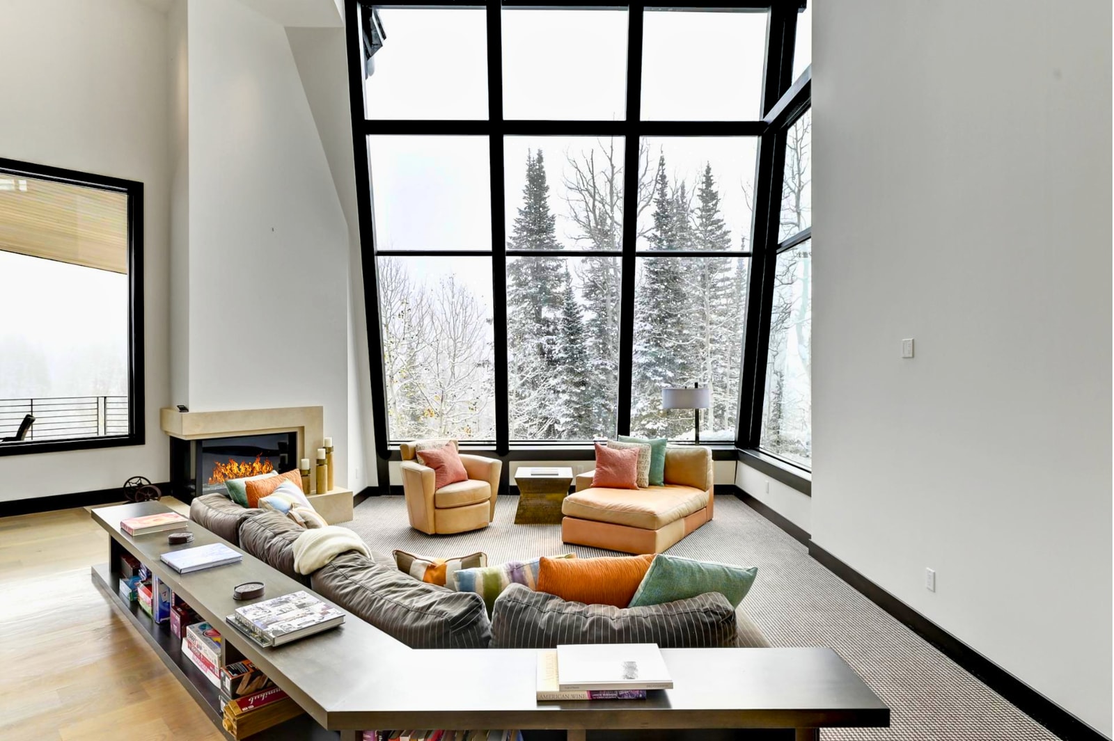 Lounge in style surrounded by forest views and floor-to-ceiling glass.