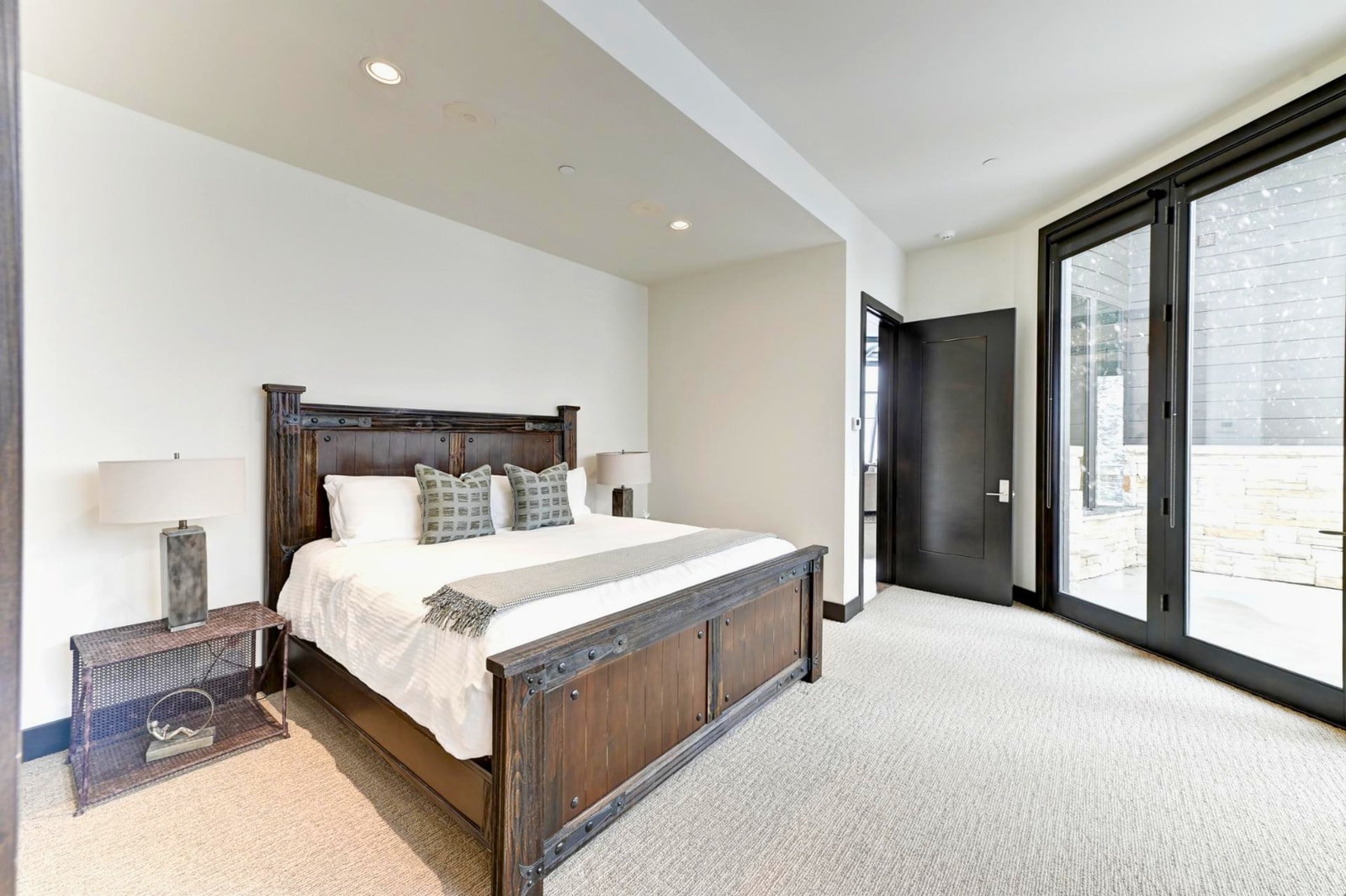 Bright and spacious layout with warm wood furnishings and forest views.