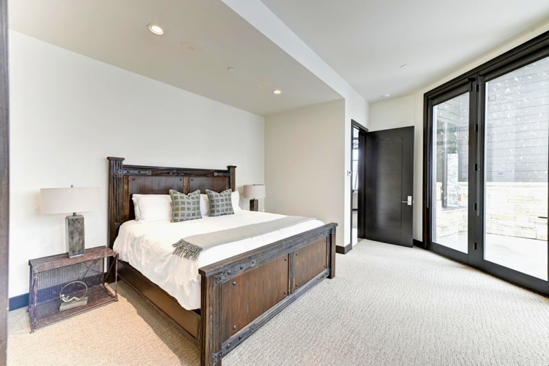 Bright and spacious layout with warm wood furnishings and forest views.