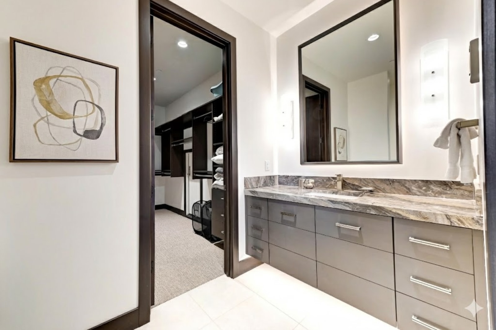 Guest ensuite with dual sinks and modern fixtures for a luxury experience.