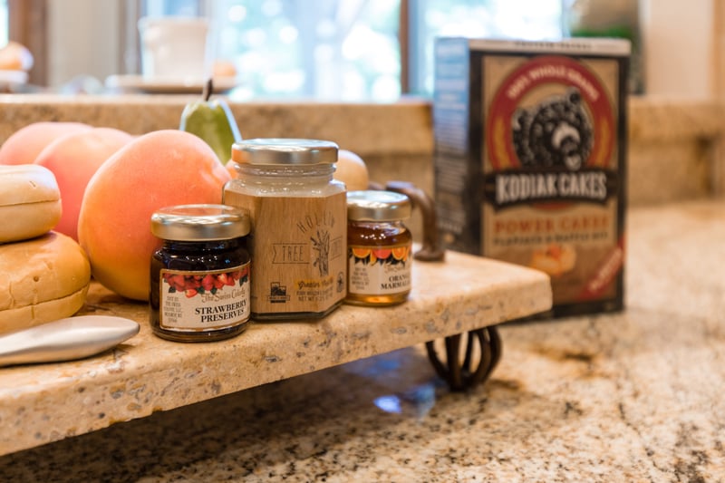 Details like stone backsplash and wood trim elevate your meal prep experience.