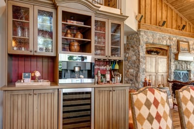Built-in wine fridge and bar cabinetry keep your favorite vintages close at hand.