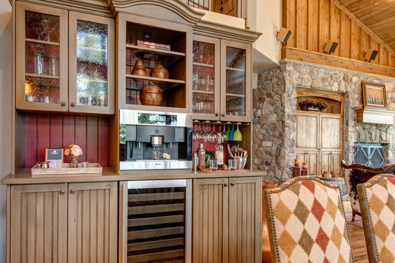 Built-in wine fridge and bar cabinetry keep your favorite vintages close at hand.