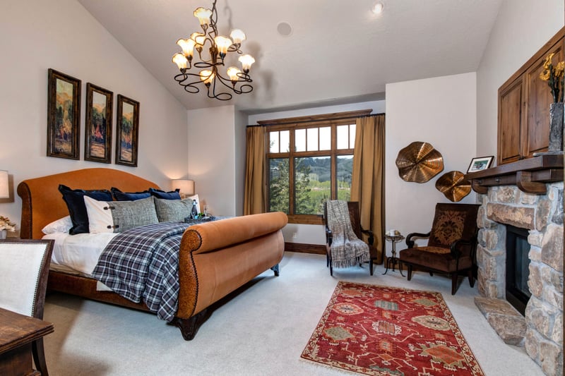 This main-level suite features a King bed, fireplace and sitting area