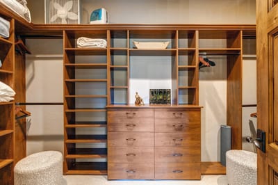 This walk-in closet offers built-ins and ample space to unpack and settle in.