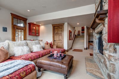 Lower-level family room opens to additional sleeping quarters and game space.