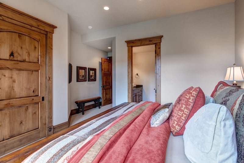 A second view of this spacious King suite with warm tones and rustic finishes.