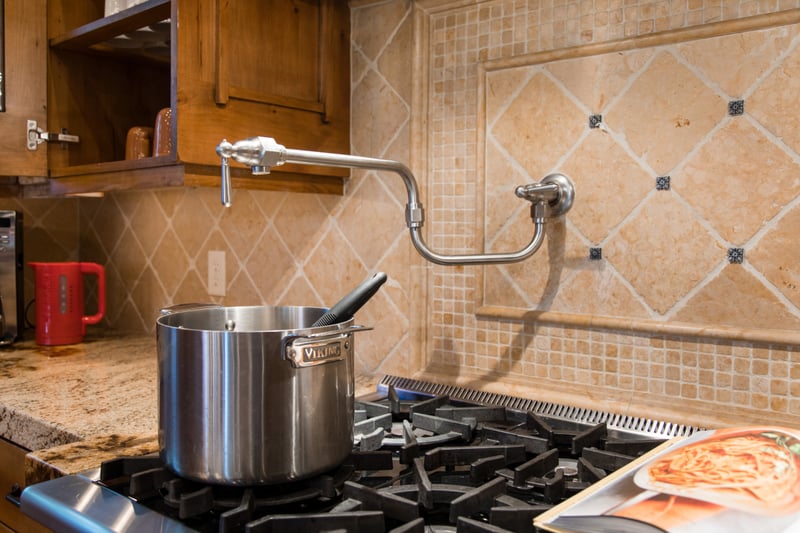 Six-burner range and prep sink make this a dream kitchen for cooking