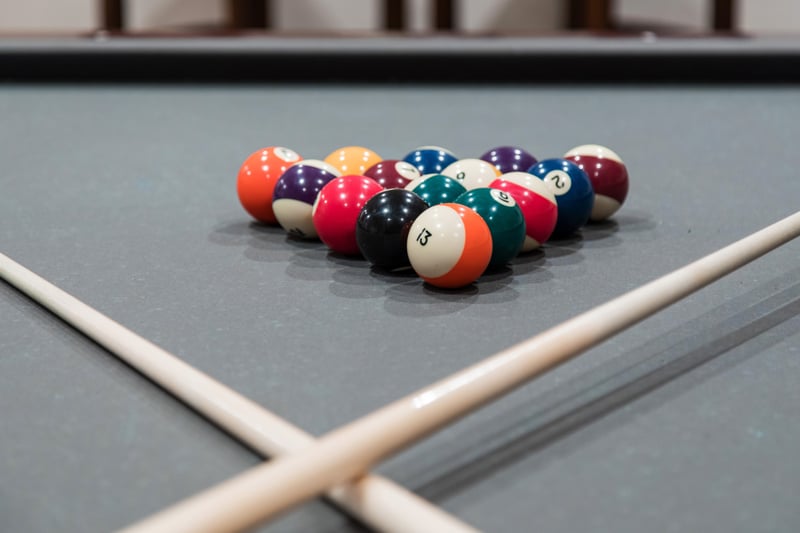Classic billiards table and lodge decor for après-ski evenings indoors.