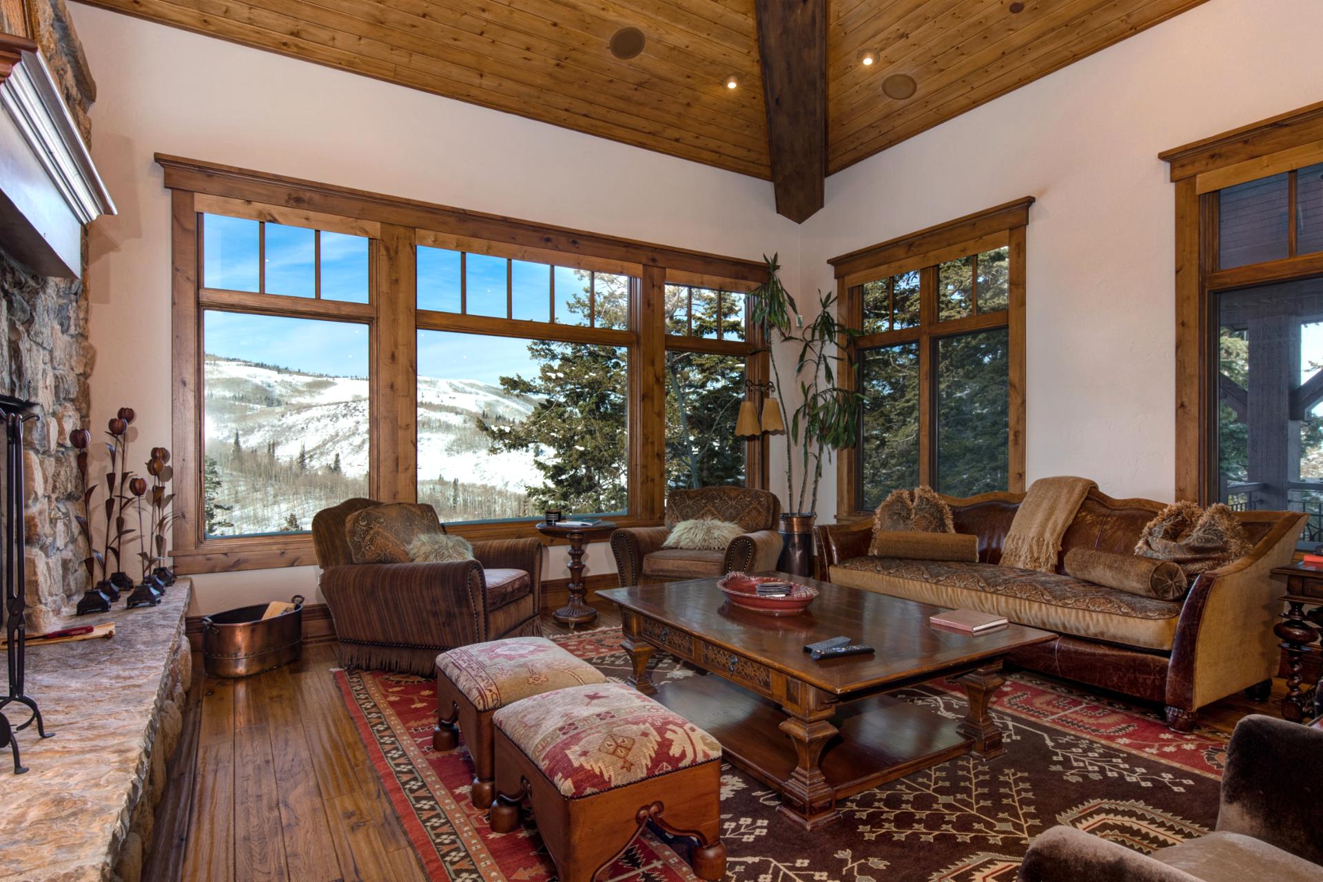 Warm textures and a stone fireplace welcome you to relax after a day on the slopes.