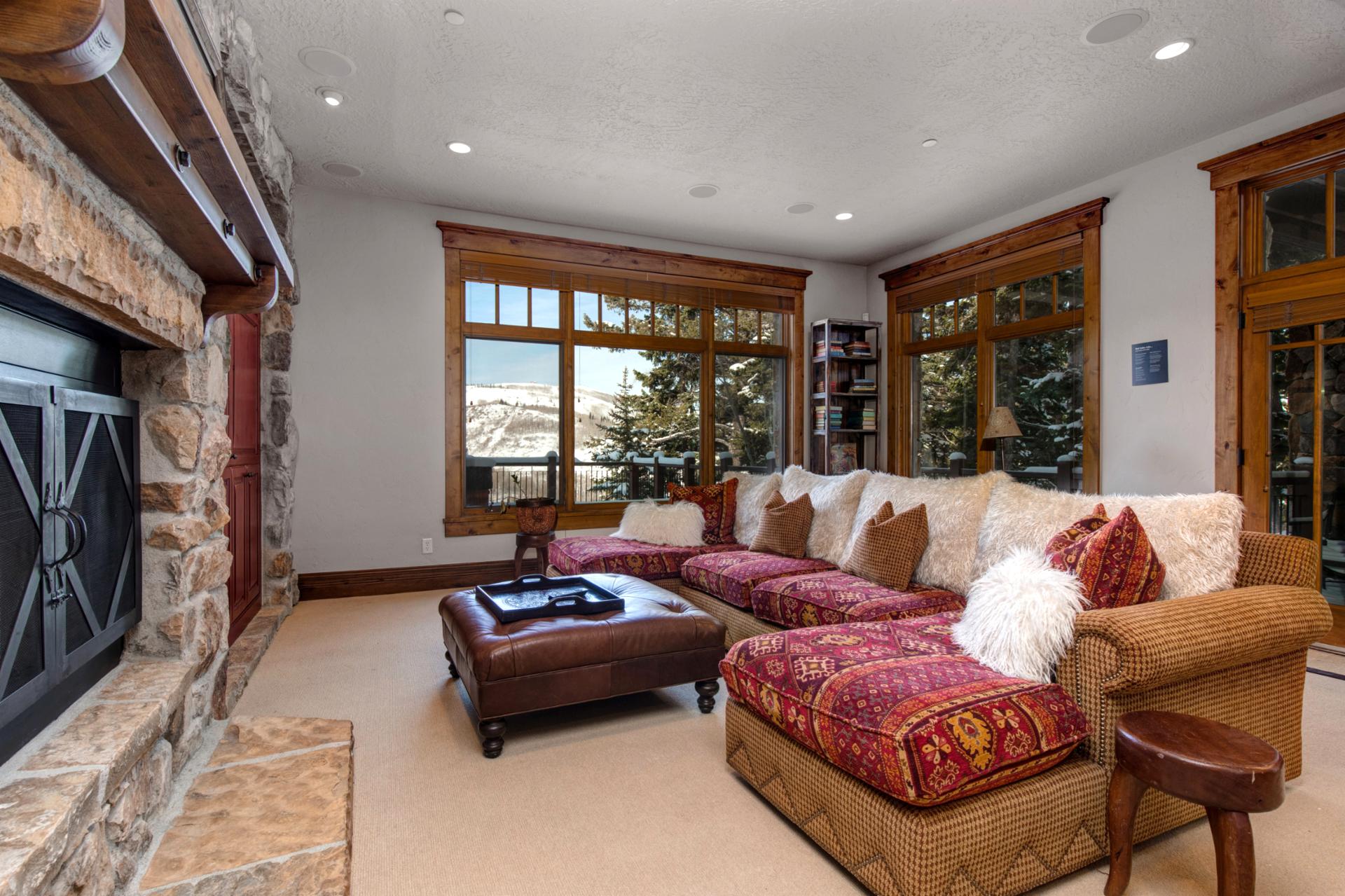 Curl up with a movie or enjoy the view in this light-filled lower-level lounge.