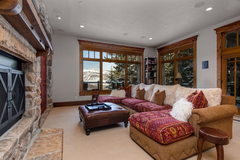 Curl up with a movie or enjoy the view in this light-filled lower-level family room