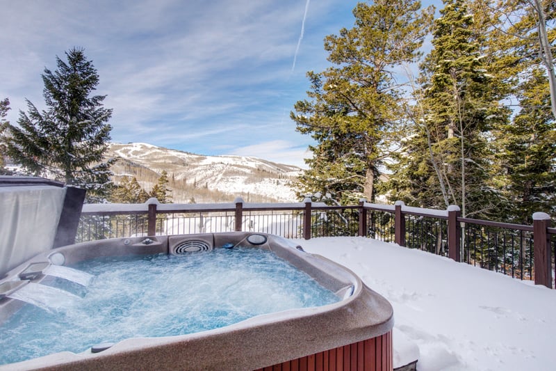 Soak in the private hot tub as snow falls or stars appear over the mountain skyline.