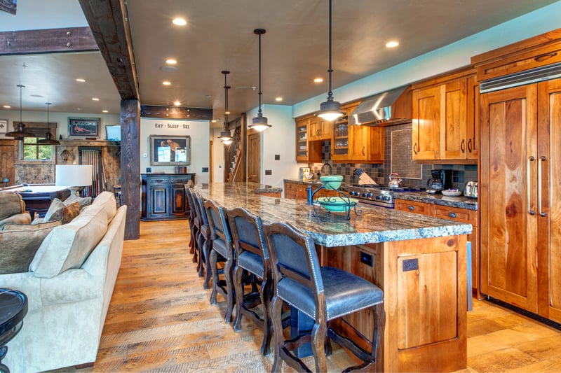 Your fully equipped kitchen features granite counters, high-end appliances, and bar seating for casual breakfasts or happy hour prep.