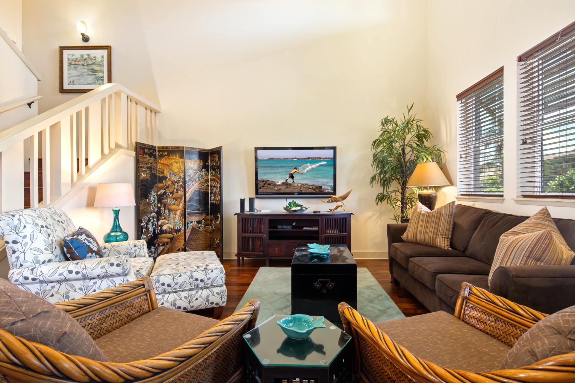 A symphony of rattan, rich wood, and open light welcomes you to relax and unwind