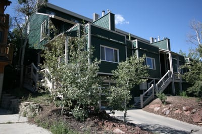 Well-maintained landscaping frames the building’s updated exterior and peaceful setting.