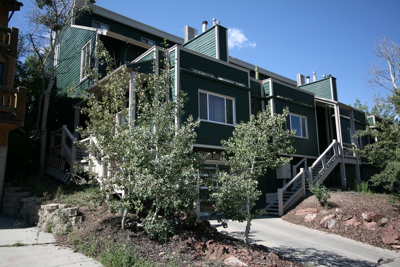 Well-maintained landscaping frames the building’s updated exterior and peaceful setting.