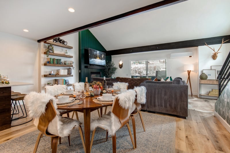 The dining area connects seamlessly to the living room, making mealtimes social and convenient.