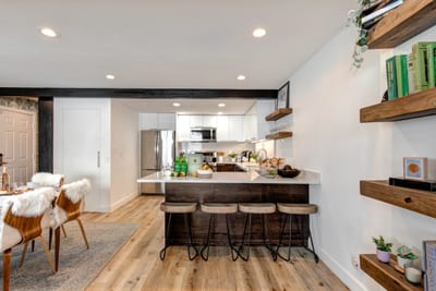 This kitchen view shows the clean, airy layout perfect for group cooking or quick breakfasts.